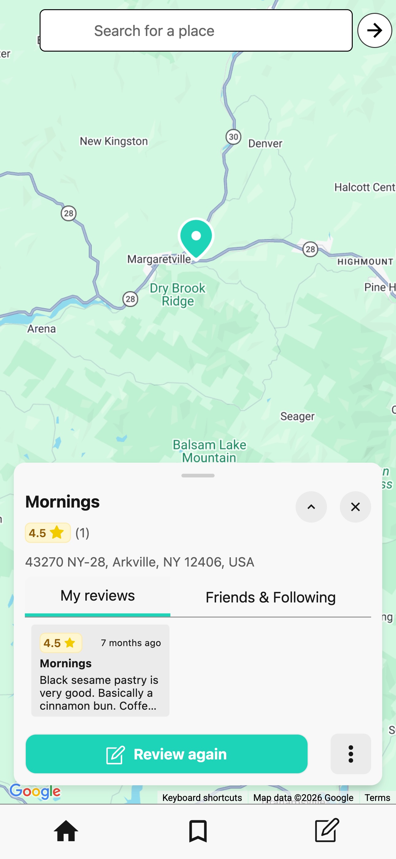 A screenshot of a cafe in upstate New York with a Memolli review pinned on the map.